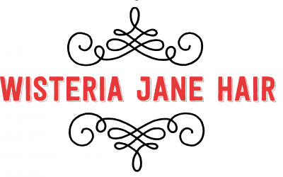 A red and black logo for the victoria jane hotel.