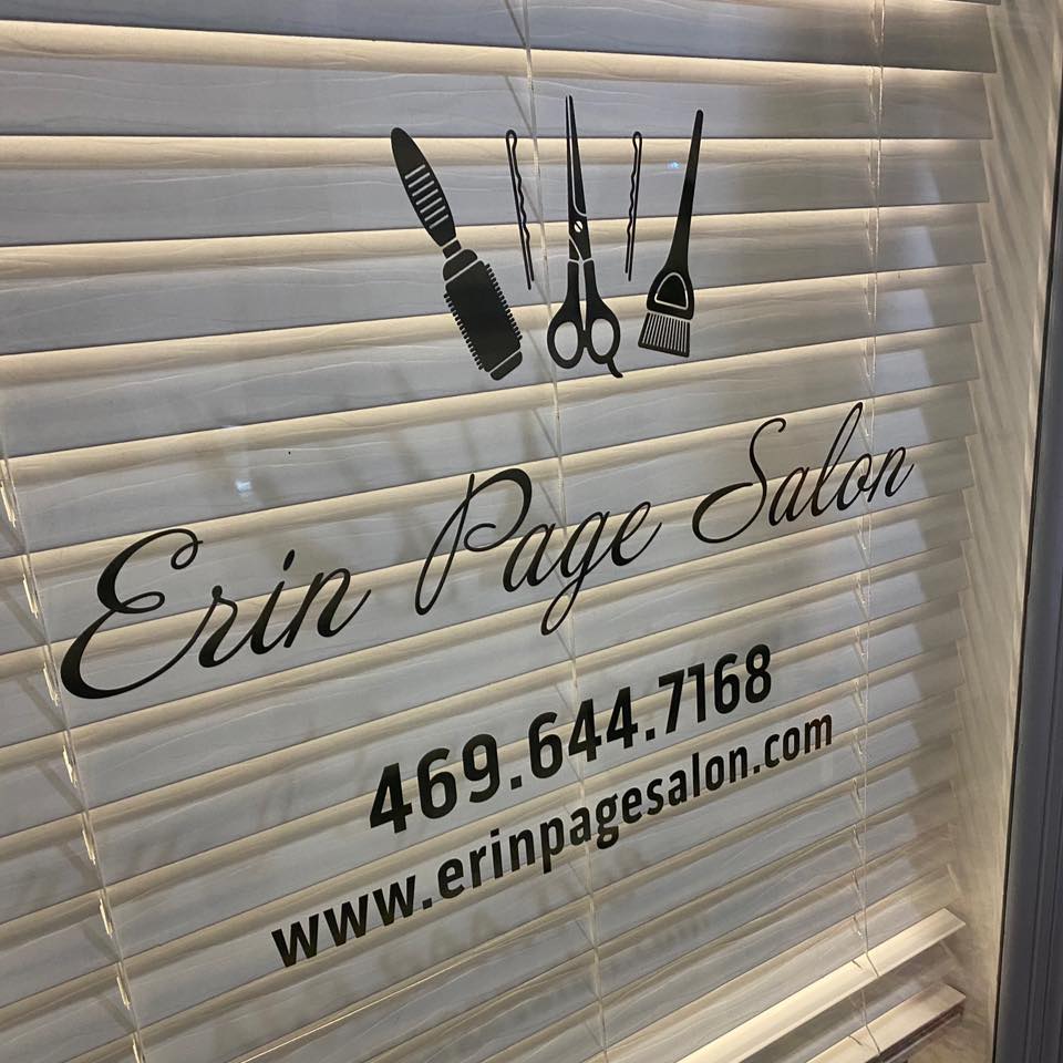 A sign for the erin page salon